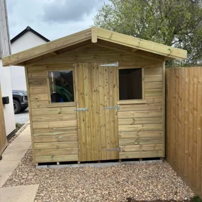 A garden shed with two windows, custom made in Cornwall by South West Garden Buildings